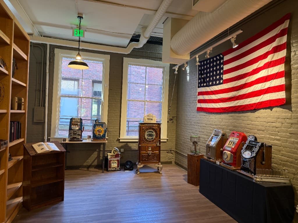 Vintage slot machines and American flag decor arranged inside the Beautiful Things gallery.